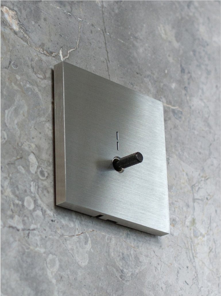 TPMEC toggle switch on marble wall